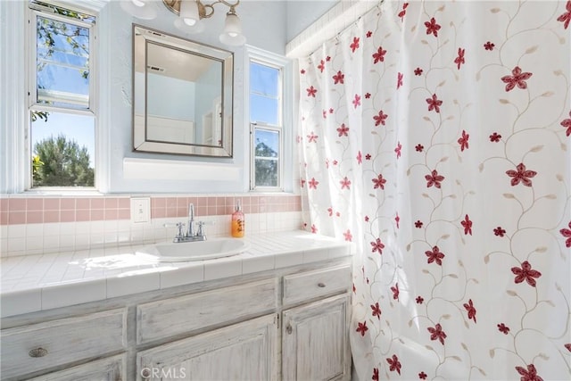 bathroom with vanity and a healthy amount of sunlight