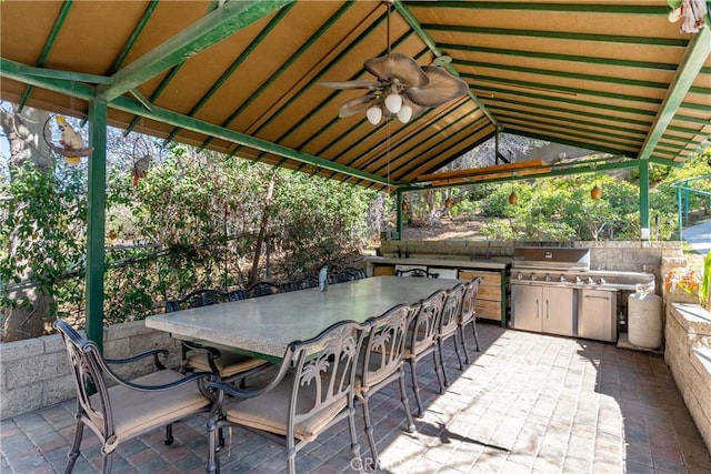 view of patio with a grill, a ceiling fan, exterior kitchen, and a gazebo