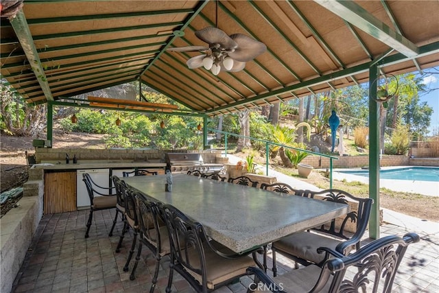 view of patio / terrace with a fenced in pool, outdoor dining space, ceiling fan, and fence