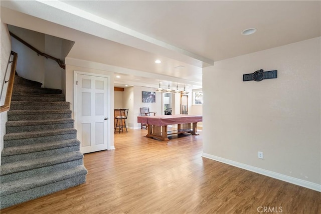 interior space featuring billiards, baseboards, and wood finished floors