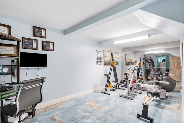 interior space with beamed ceiling and baseboards