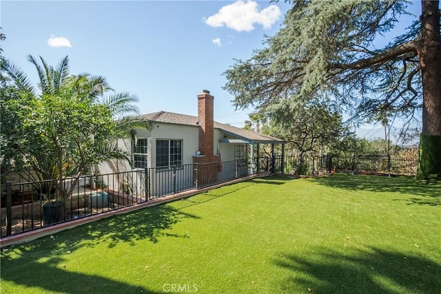 view of yard featuring a fenced backyard