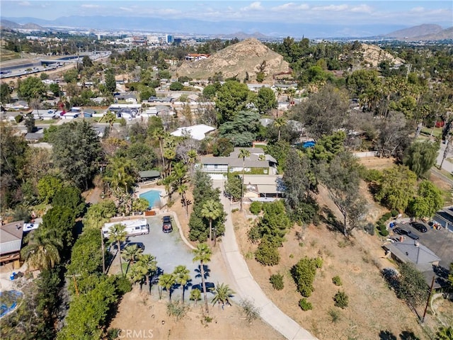 birds eye view of property featuring a mountain view