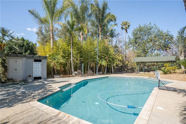 outdoor pool featuring a patio area