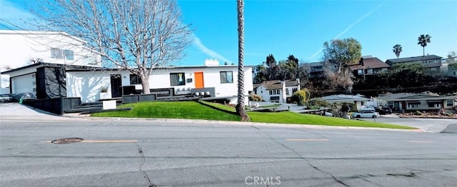 view of front of property with a front lawn