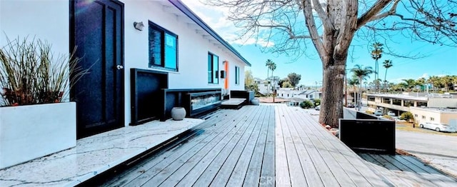wooden deck with a residential view
