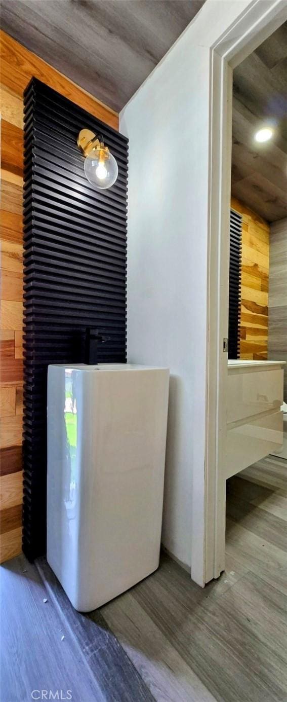 details with wooden walls and wood finished floors