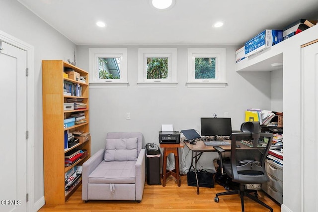 office with a healthy amount of sunlight and light wood-type flooring