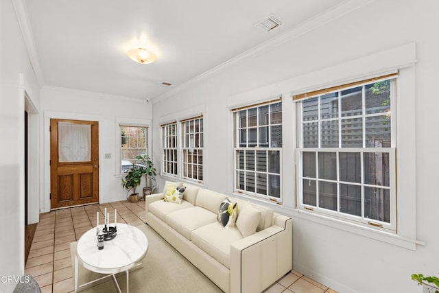 living room with ornamental molding and light tile patterned floors