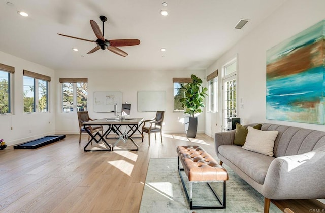 living area featuring recessed lighting, visible vents, a ceiling fan, light wood-type flooring, and baseboards