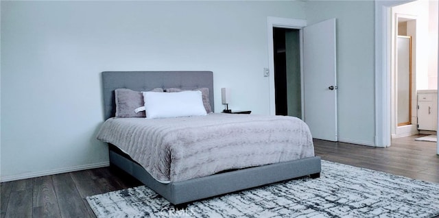 bedroom featuring dark hardwood / wood-style flooring