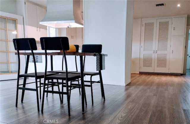 dining room featuring dark hardwood / wood-style flooring