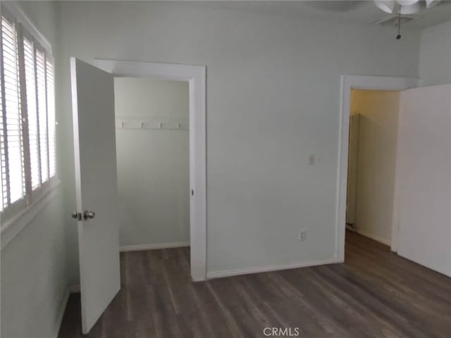 interior space featuring dark hardwood / wood-style floors and a closet