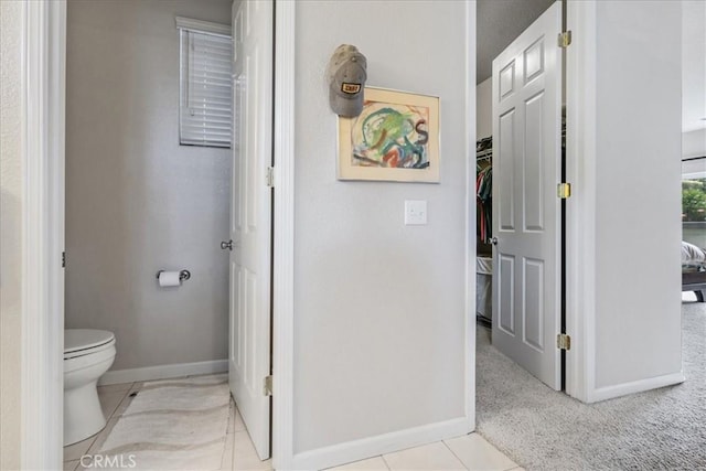 bathroom featuring tile patterned floors and toilet