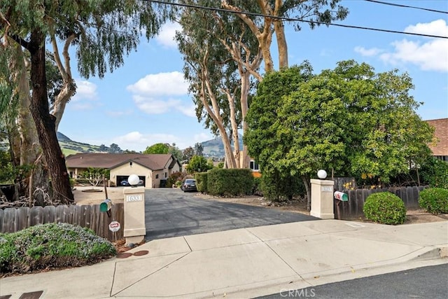 obstructed view of property with a mountain view