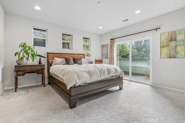 carpeted bedroom featuring access to outside