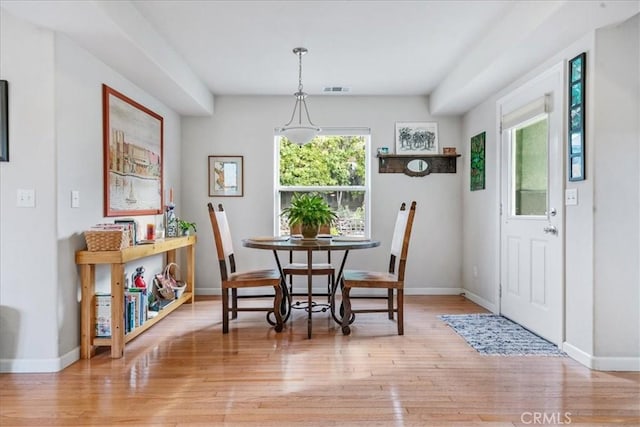 dining area with light hardwood / wood-style floors