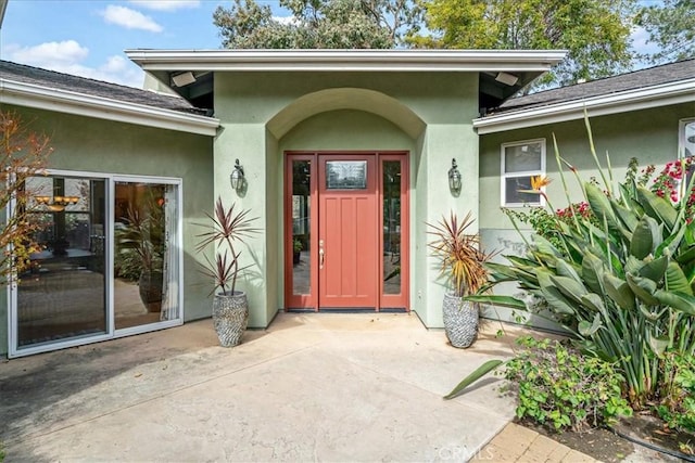 doorway to property with a patio