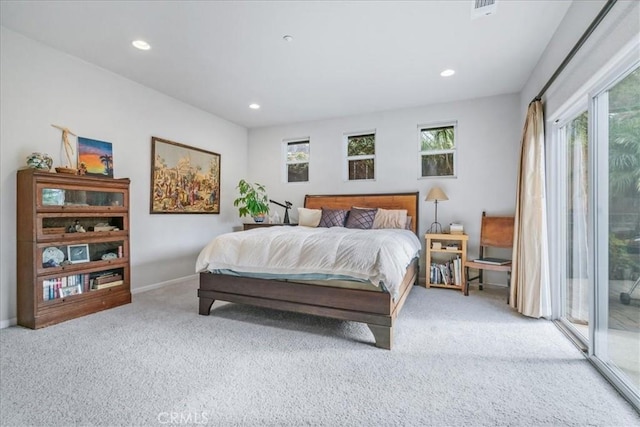 carpeted bedroom featuring access to outside