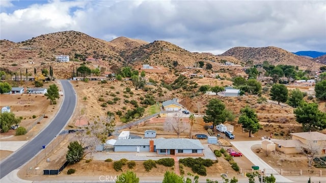 drone / aerial view featuring a mountain view