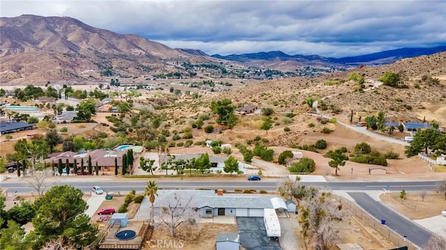 birds eye view of property featuring a mountain view