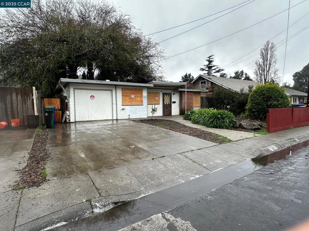 ranch-style house featuring a garage