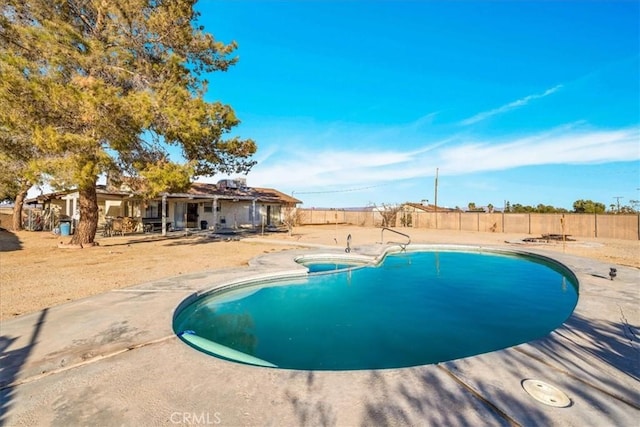 view of swimming pool with a patio area