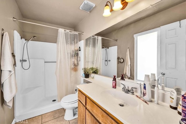 bathroom featuring a shower with curtain, tile patterned floors, toilet, and vanity