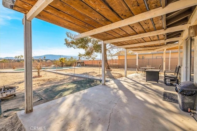 view of patio / terrace featuring a mountain view