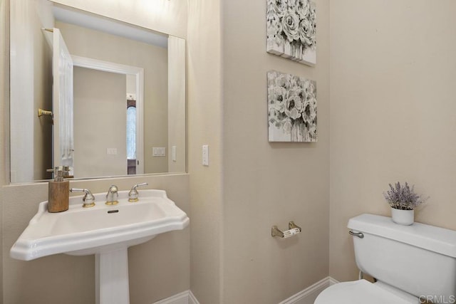 bathroom with sink and toilet