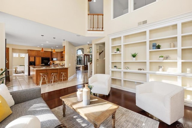 living room with a healthy amount of sunlight and light wood-type flooring