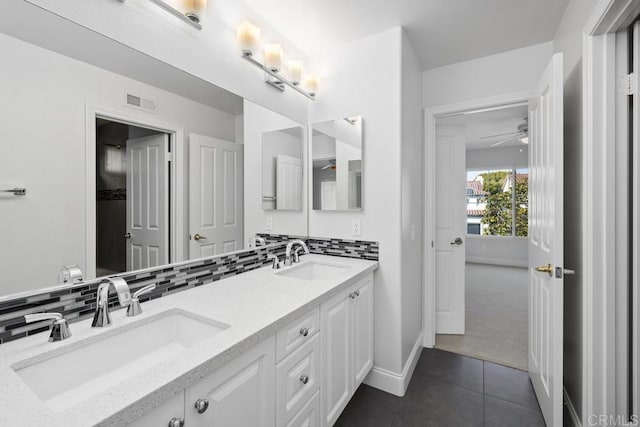 bathroom with vanity, tile patterned flooring, decorative backsplash, and ceiling fan