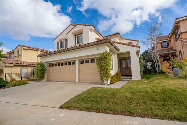 mediterranean / spanish house with stucco siding, a front lawn, a garage, and driveway