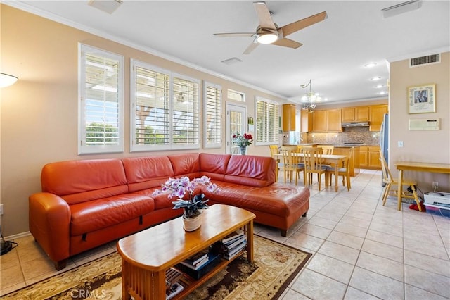 living room featuring light tile patterned floors, visible vents, ceiling fan, and ornamental molding