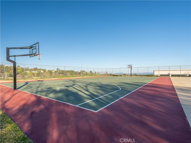 view of sport court featuring community basketball court and fence