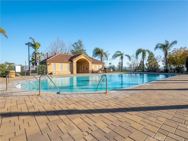 view of swimming pool featuring a patio