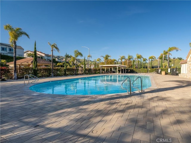 view of pool featuring a patio area