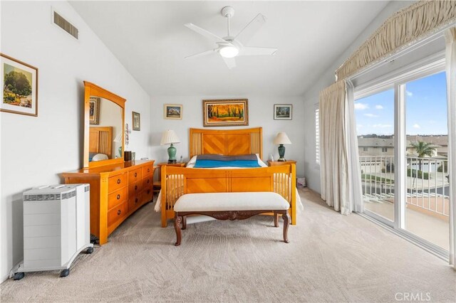 bedroom featuring radiator, visible vents, lofted ceiling, access to exterior, and light carpet