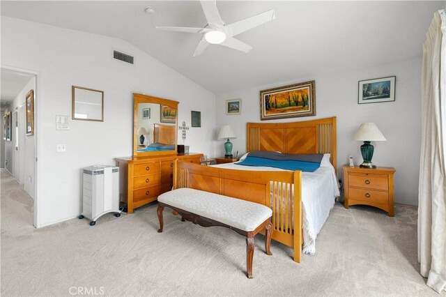 bedroom with lofted ceiling, light colored carpet, visible vents, and ceiling fan