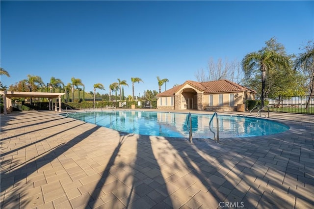 view of swimming pool featuring a patio area