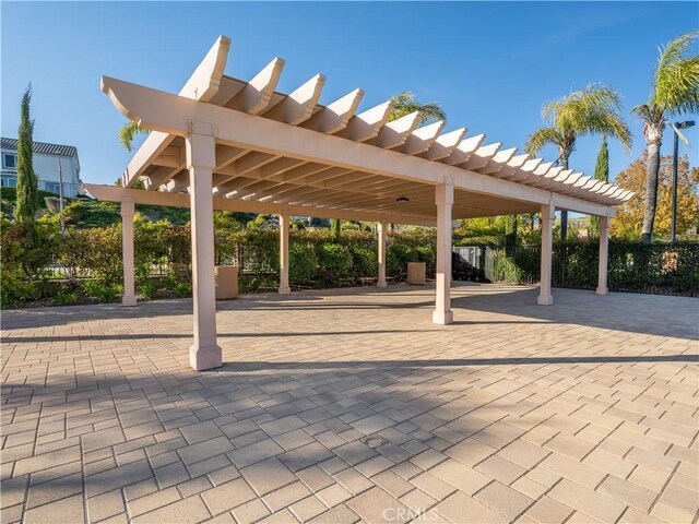 view of patio / terrace with a pergola and fence