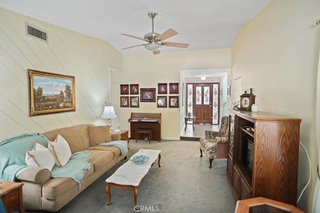 living room with ceiling fan and carpet floors