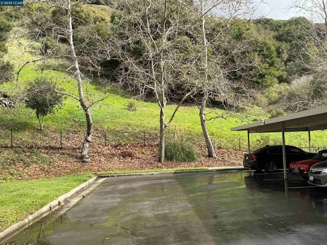 exterior space with a carport