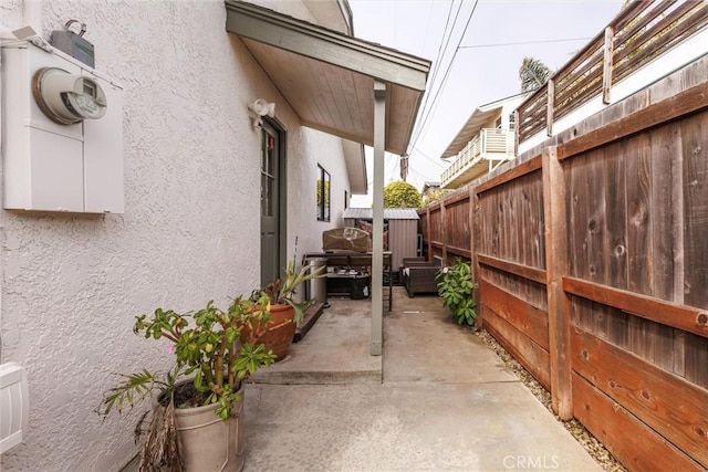 view of home's exterior with a patio area, a fenced backyard, and stucco siding