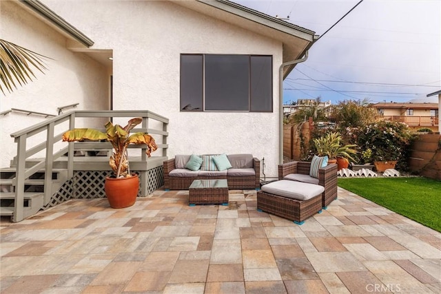view of patio / terrace with fence and an outdoor hangout area