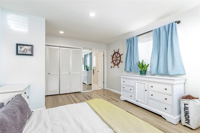 bedroom featuring light wood-type flooring, multiple windows, and recessed lighting