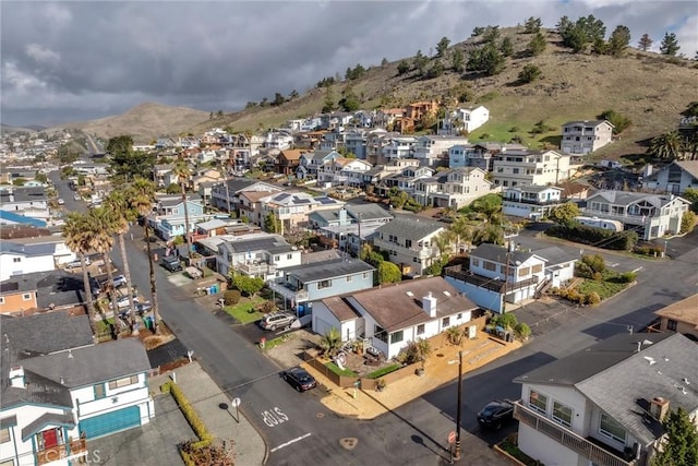 drone / aerial view featuring a residential view and a mountain view
