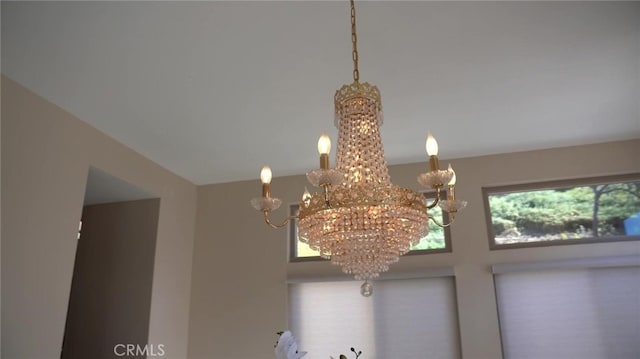 interior details featuring a notable chandelier