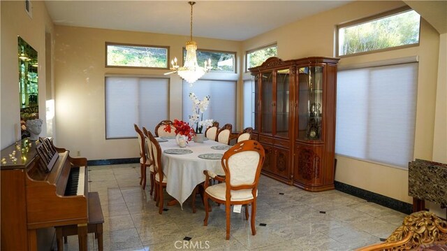 dining room with a chandelier