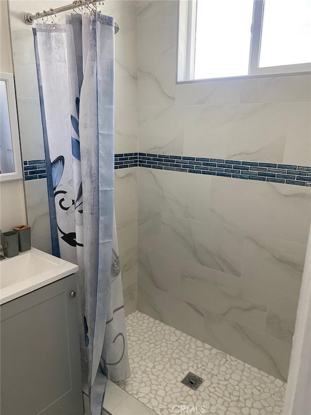 bathroom featuring vanity and a shower with curtain